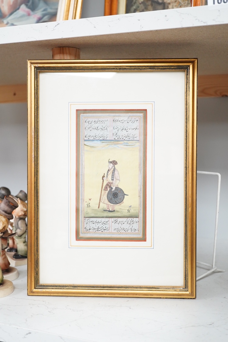 19th century Persian School, Illuminated manuscript with portrait of a warrior, bordered with calligraphy, 17 x 8.5cm